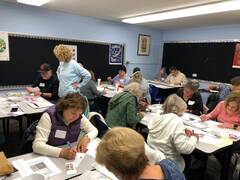   Tzedek Committee's 3rd Annual Postcard/Letter Writing event in the Sukkah